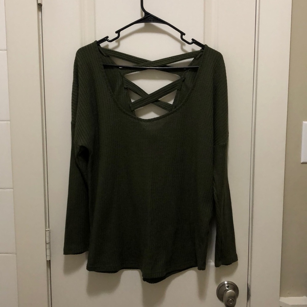 Woman’s small green sweater